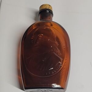 Vintage Amber Glass Bottle with Embossed Design